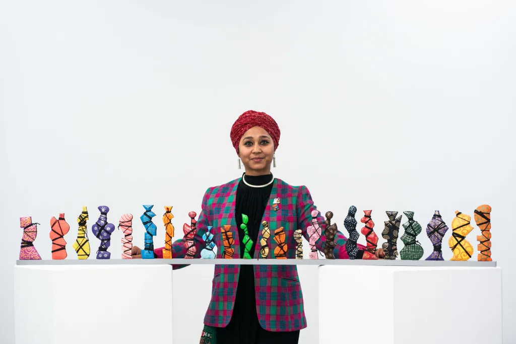Mee Jay poses with her untitled work